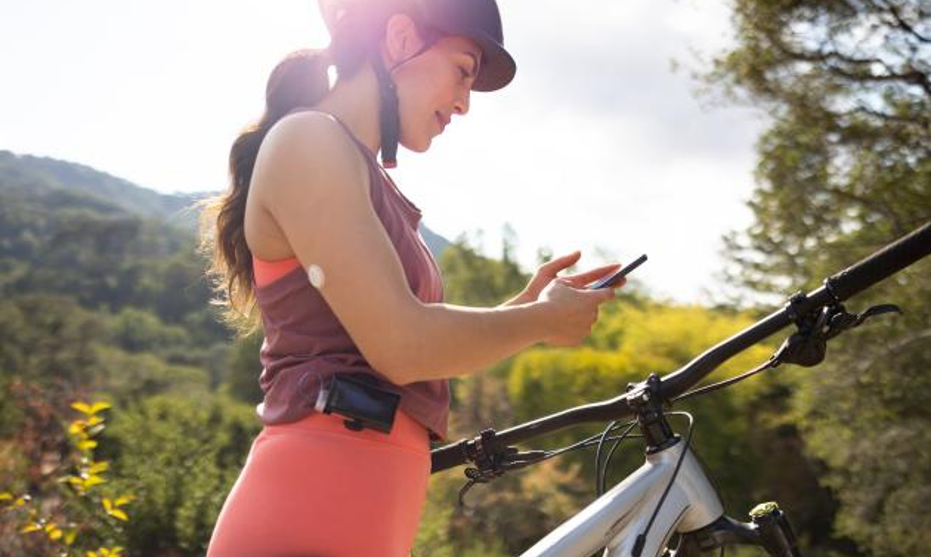 Woman working out and wearing Abbott Freestyle Libre 3 on arm
