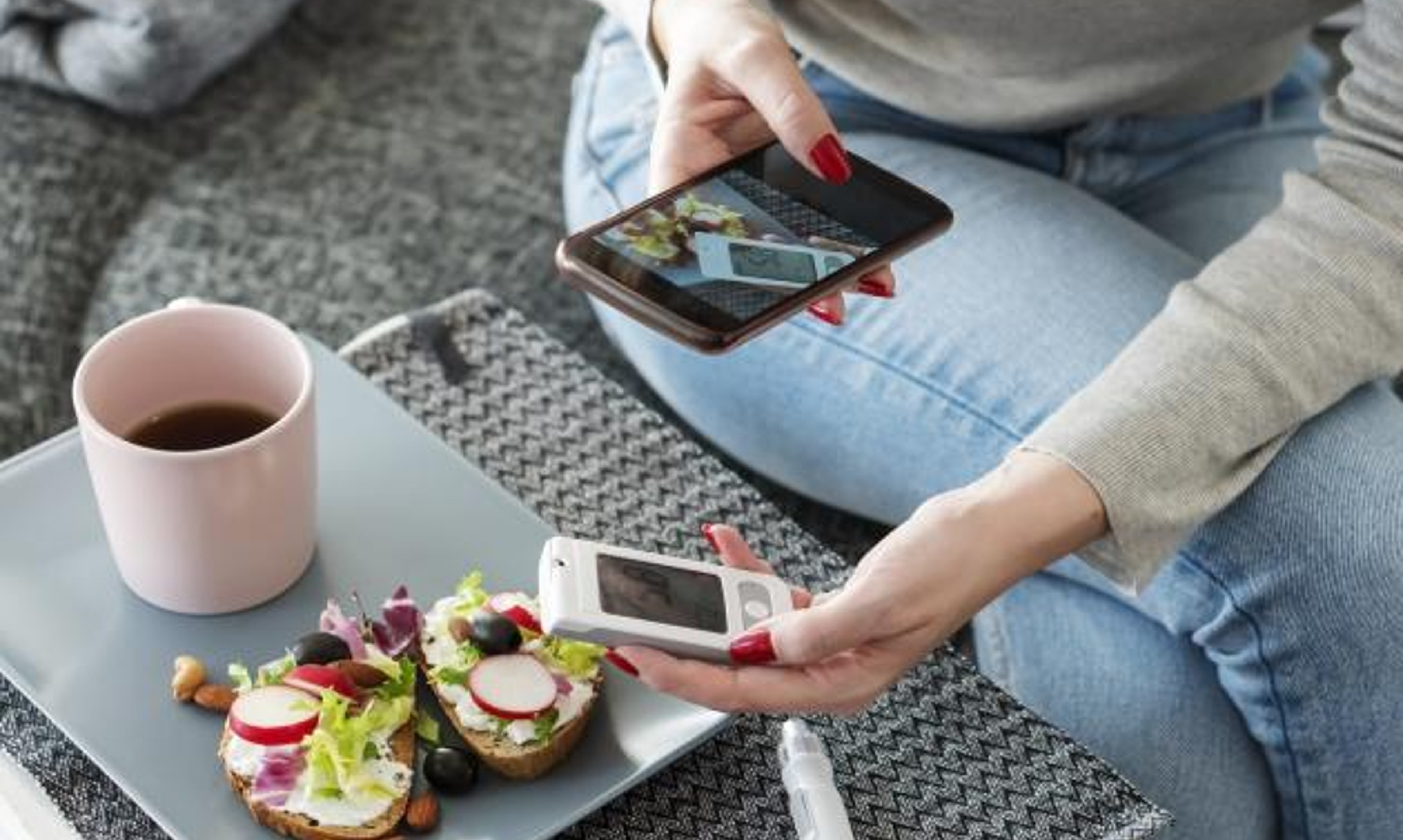 Taking a photo of food to track the carbohydrates and calories.
