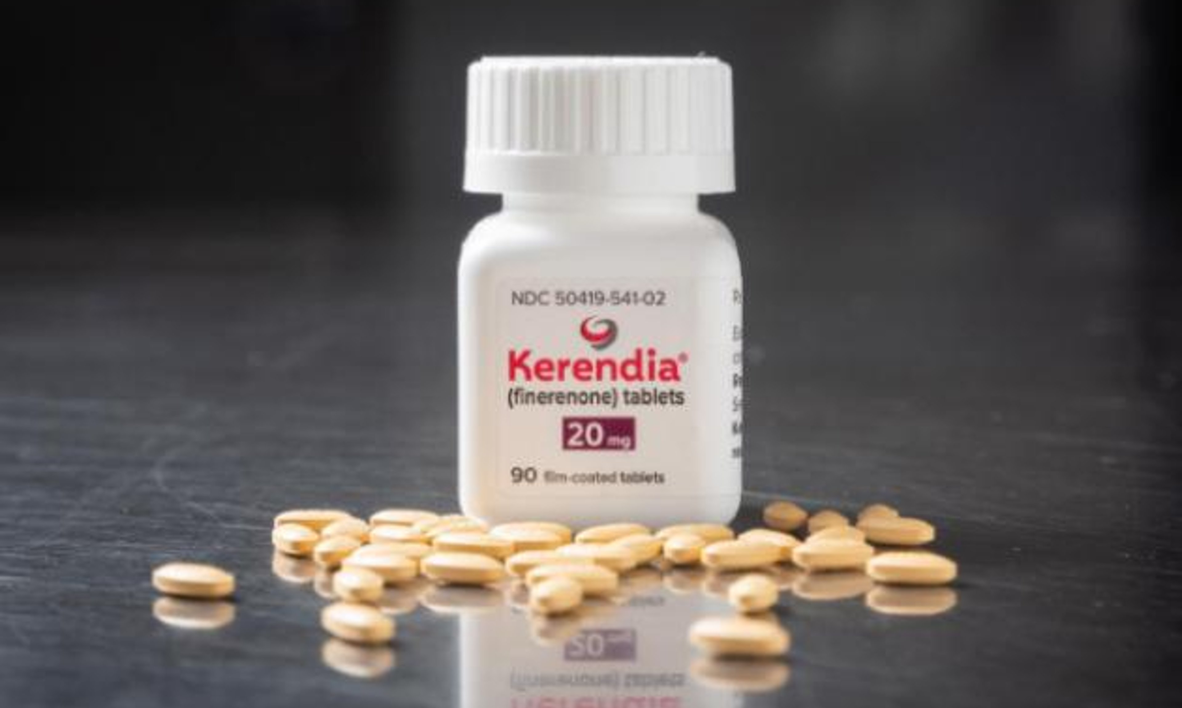 A bottle of Kerendia (finerenone) with pills spread on the ground
