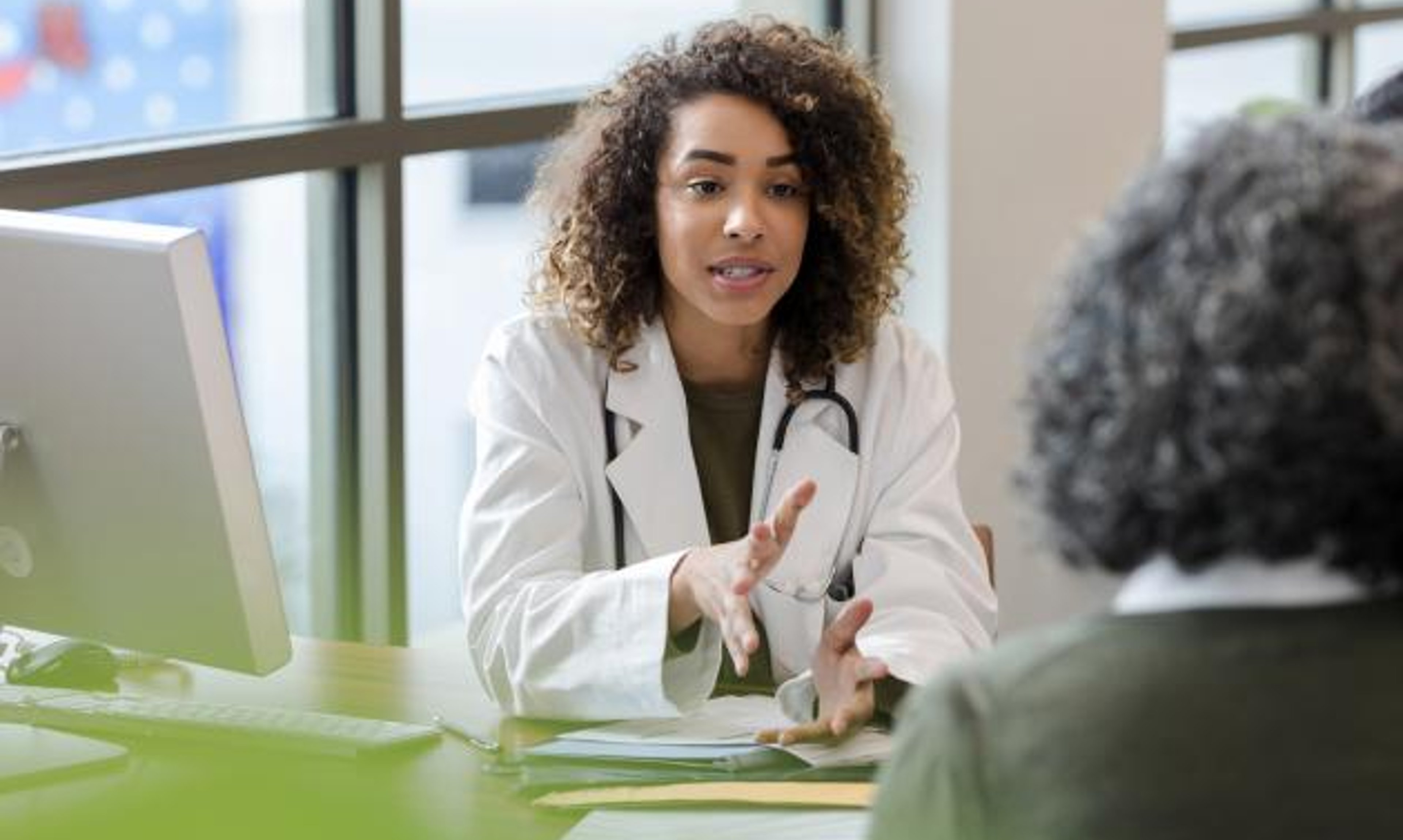 A doctor speaks with a patient.