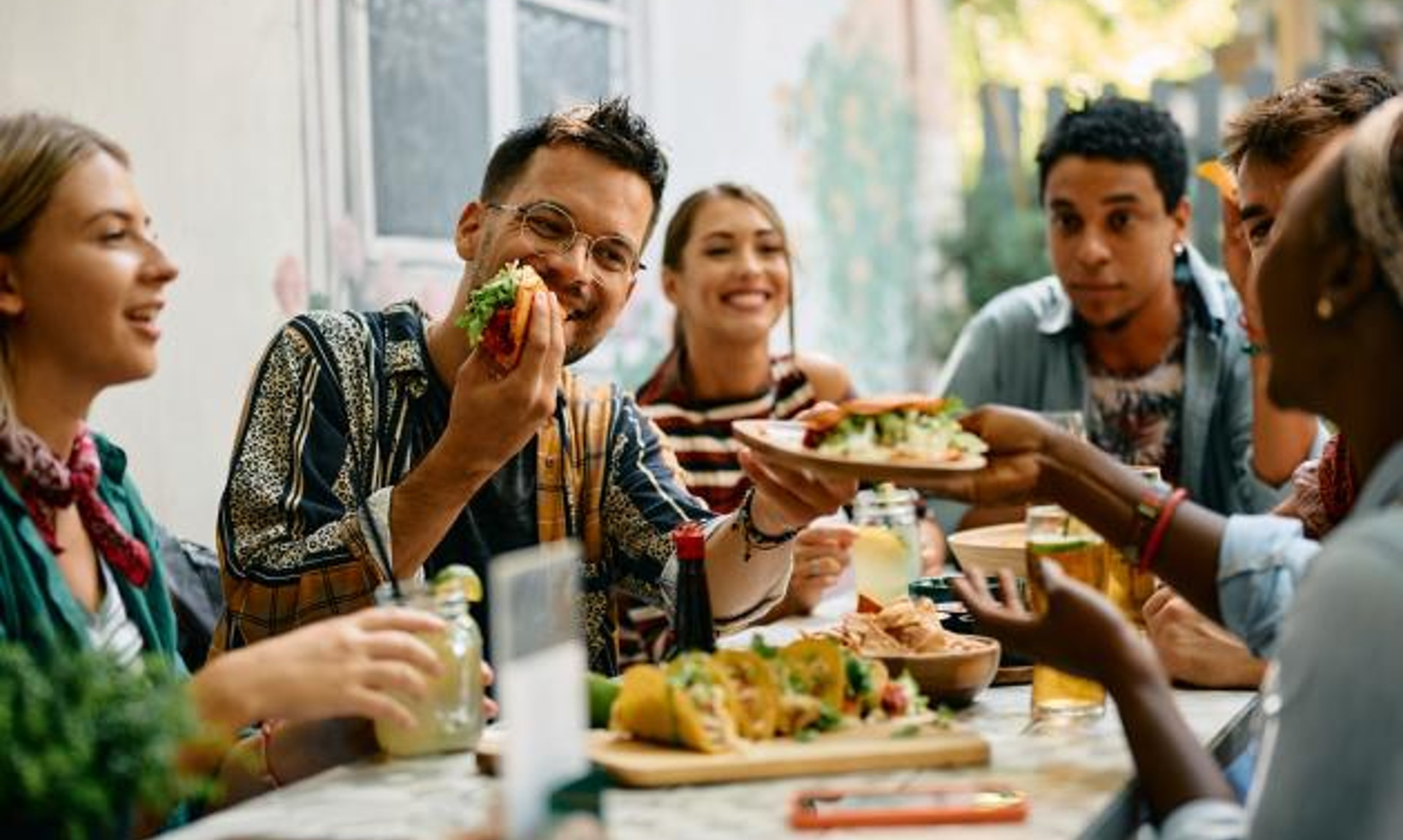 Image of happy people eating lunch together