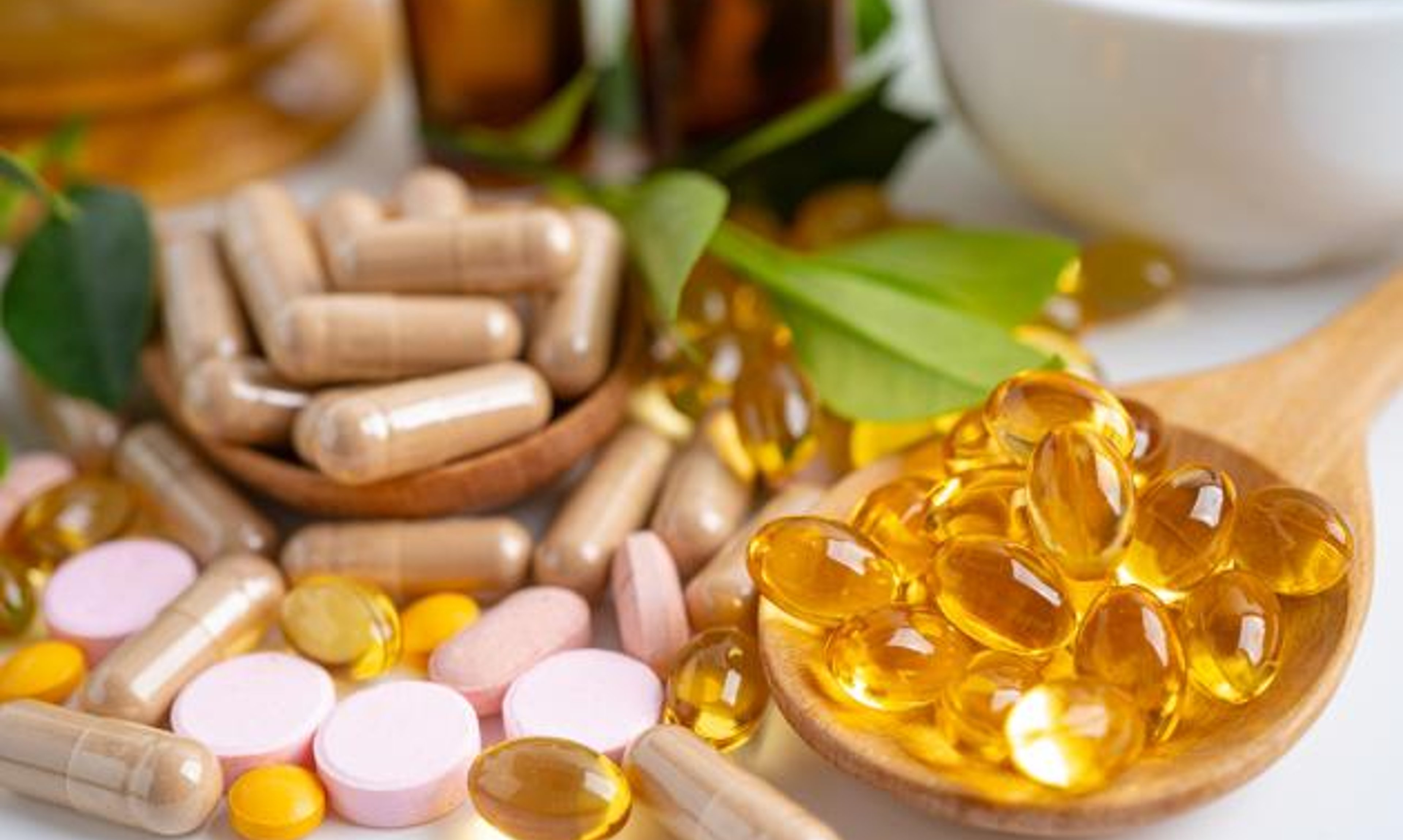 image of different colored vitamins and supplements