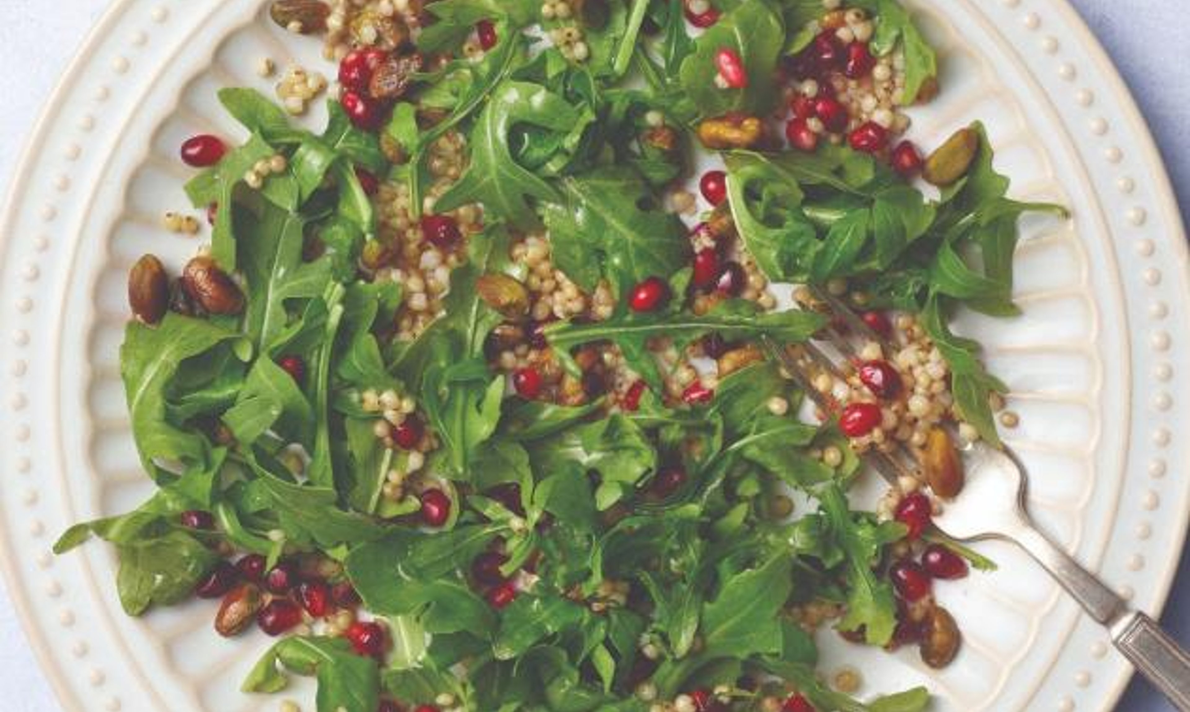 Sorghum salad with arugula, pomegranate, and pistachios