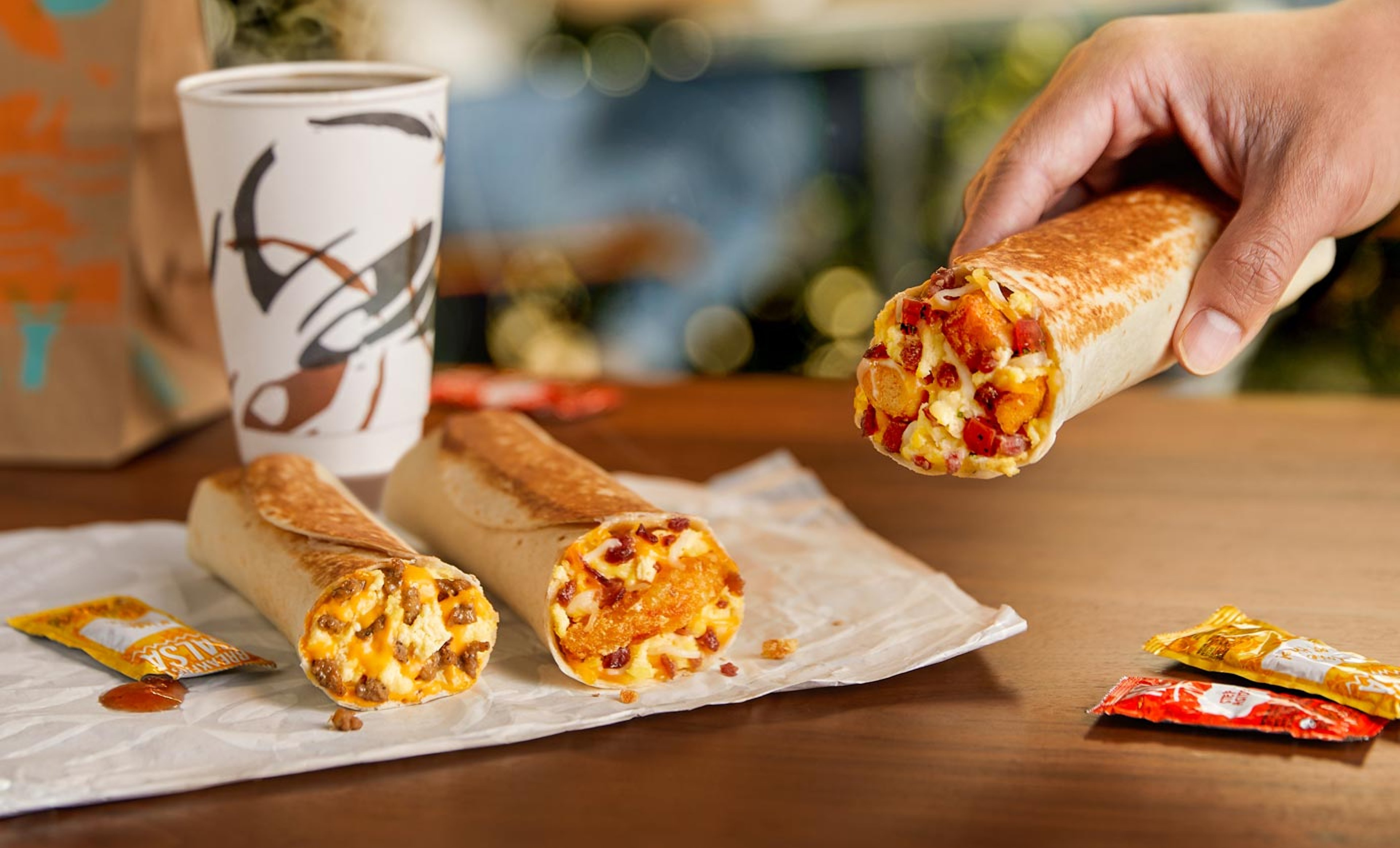 Taco Bell Breakfast Burritos with coffee in background