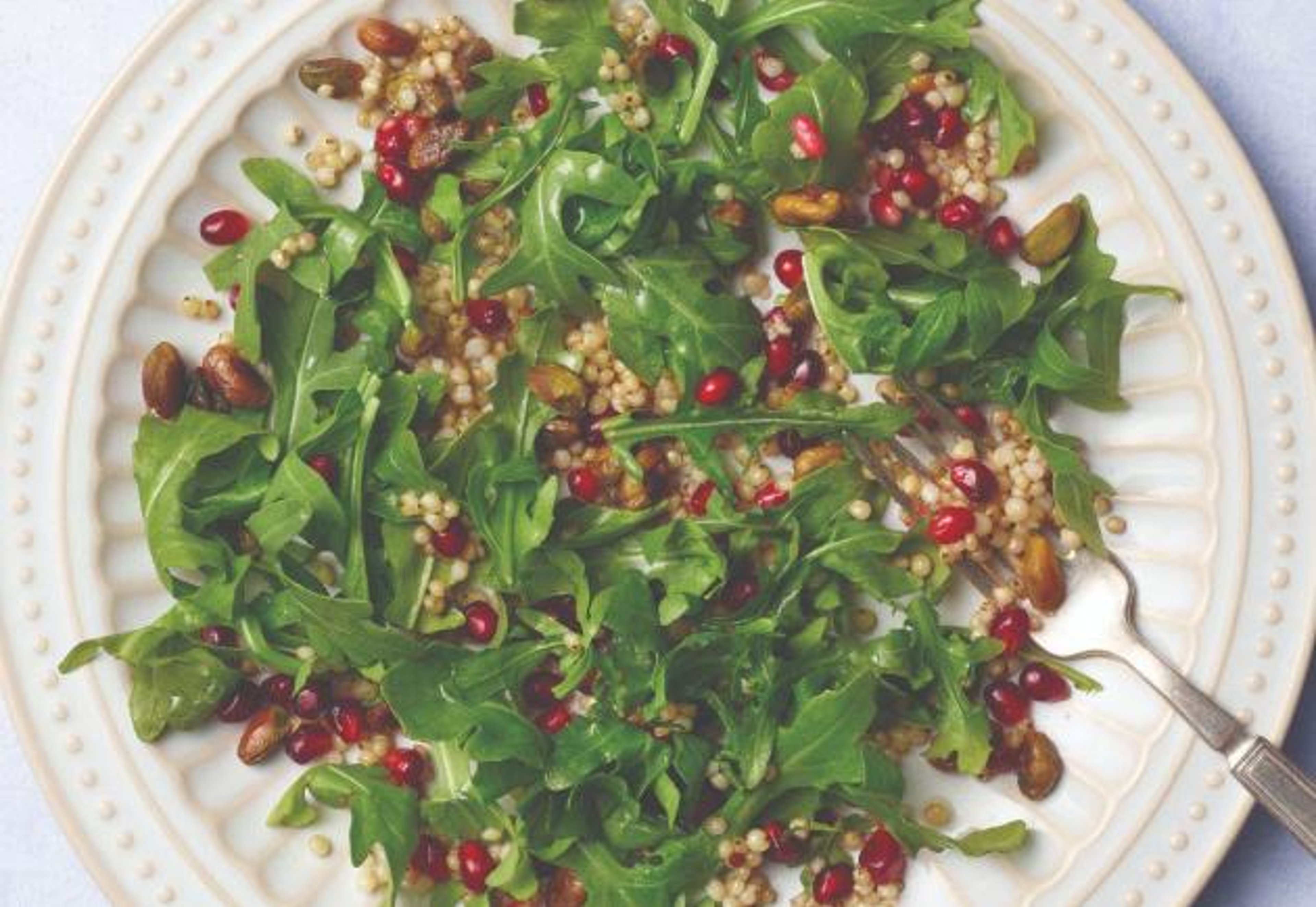 Sorghum salad with arugula, pomegranate, and pistachios