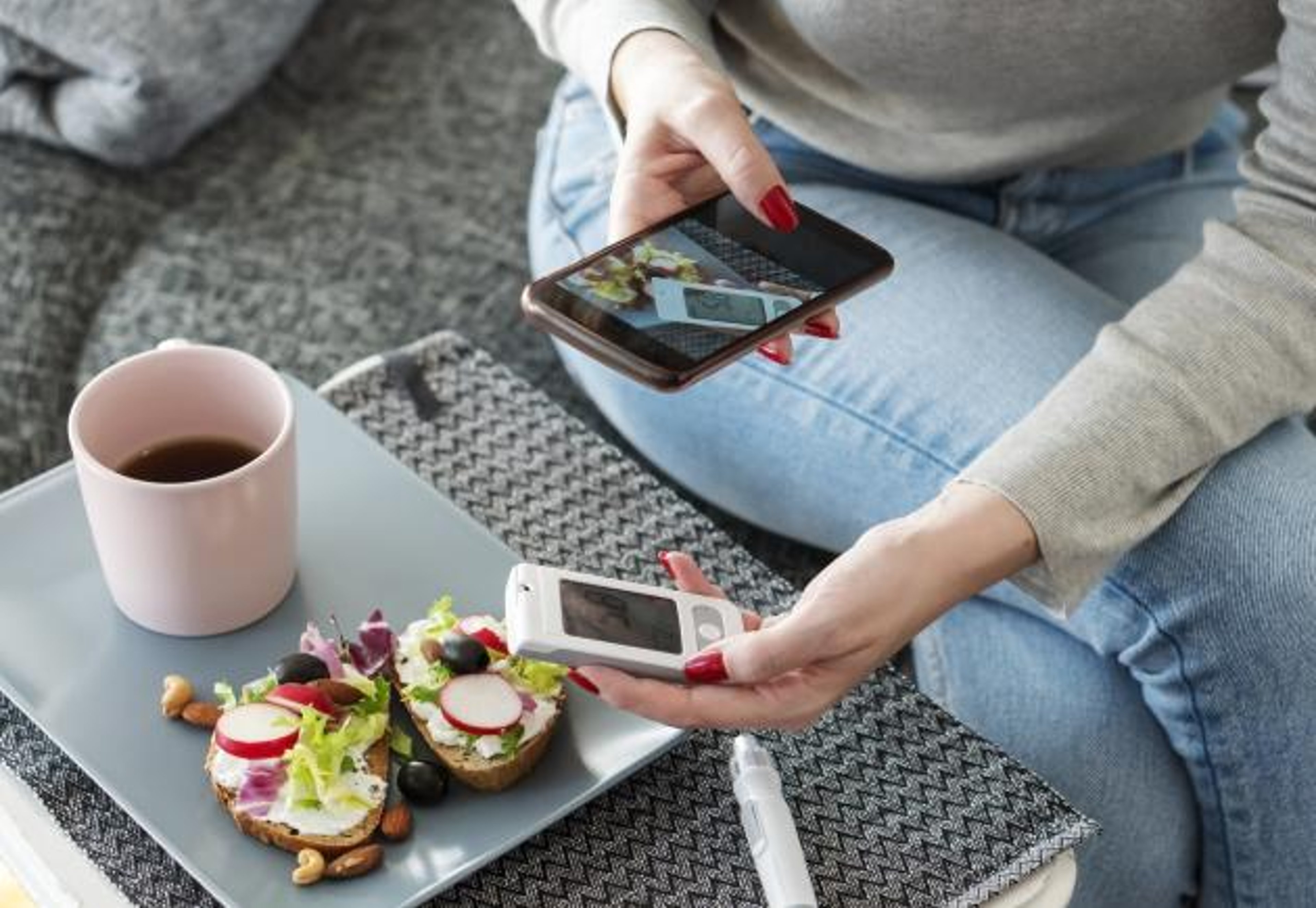 Taking a photo of food to track the carbohydrates and calories.