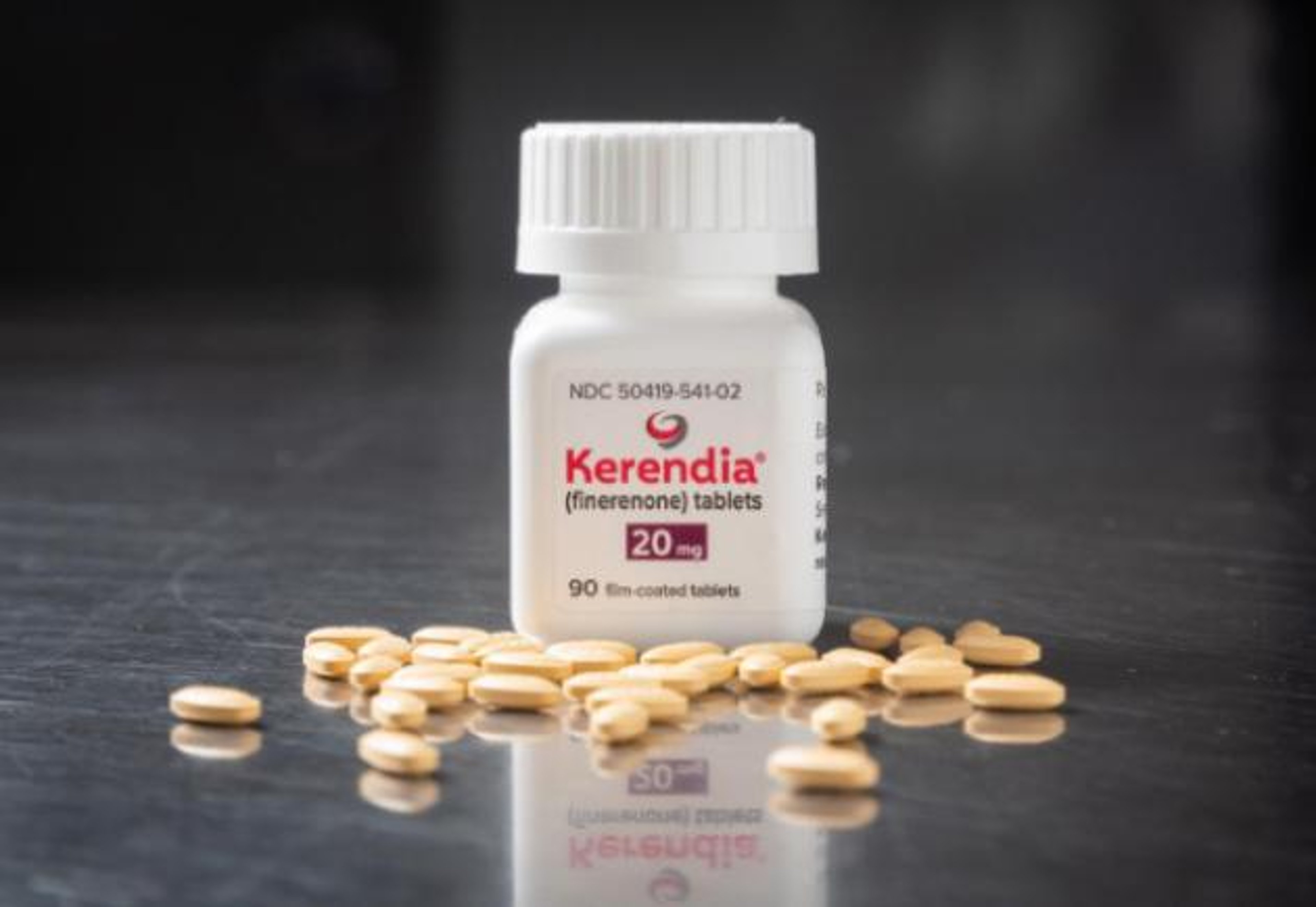 A bottle of Kerendia (finerenone) with pills spread on the ground