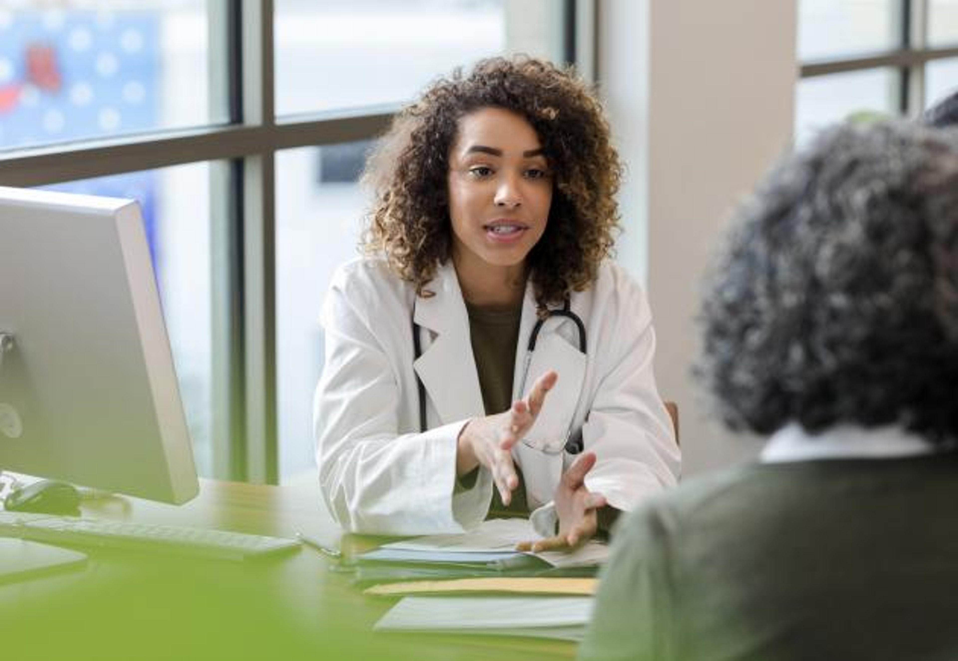 A doctor speaks with a patient.