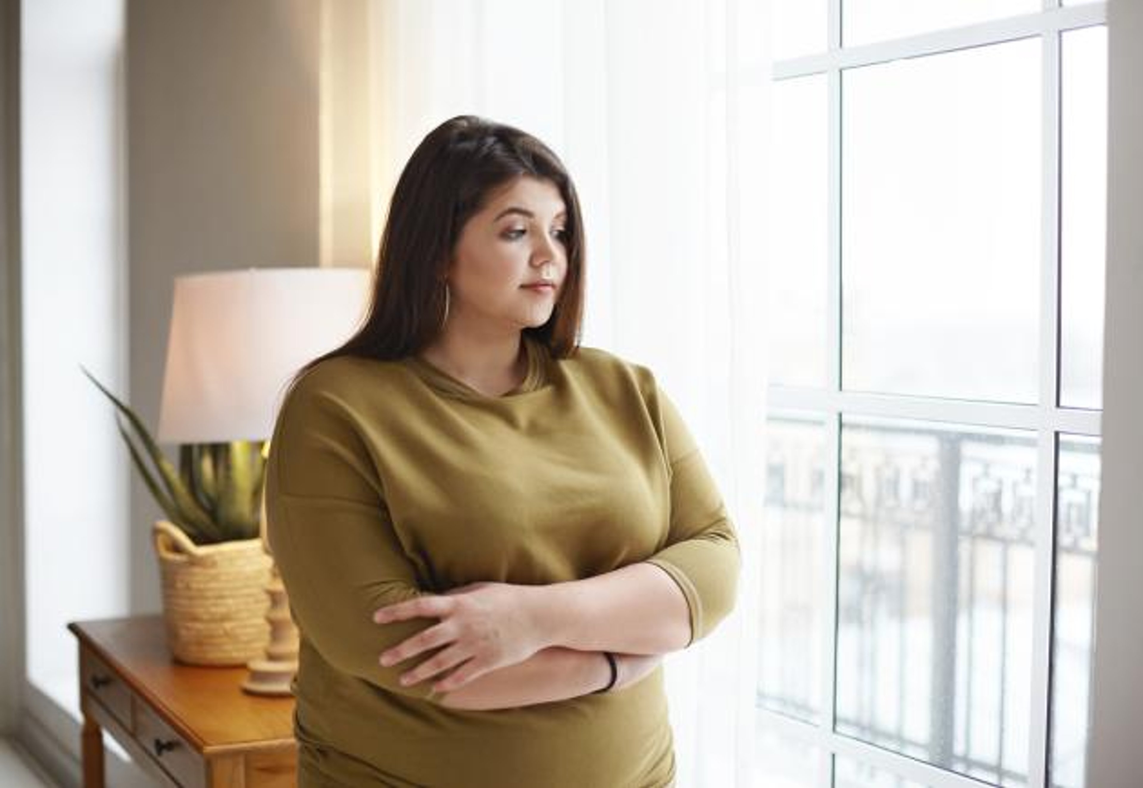 Image of woman staring out of window