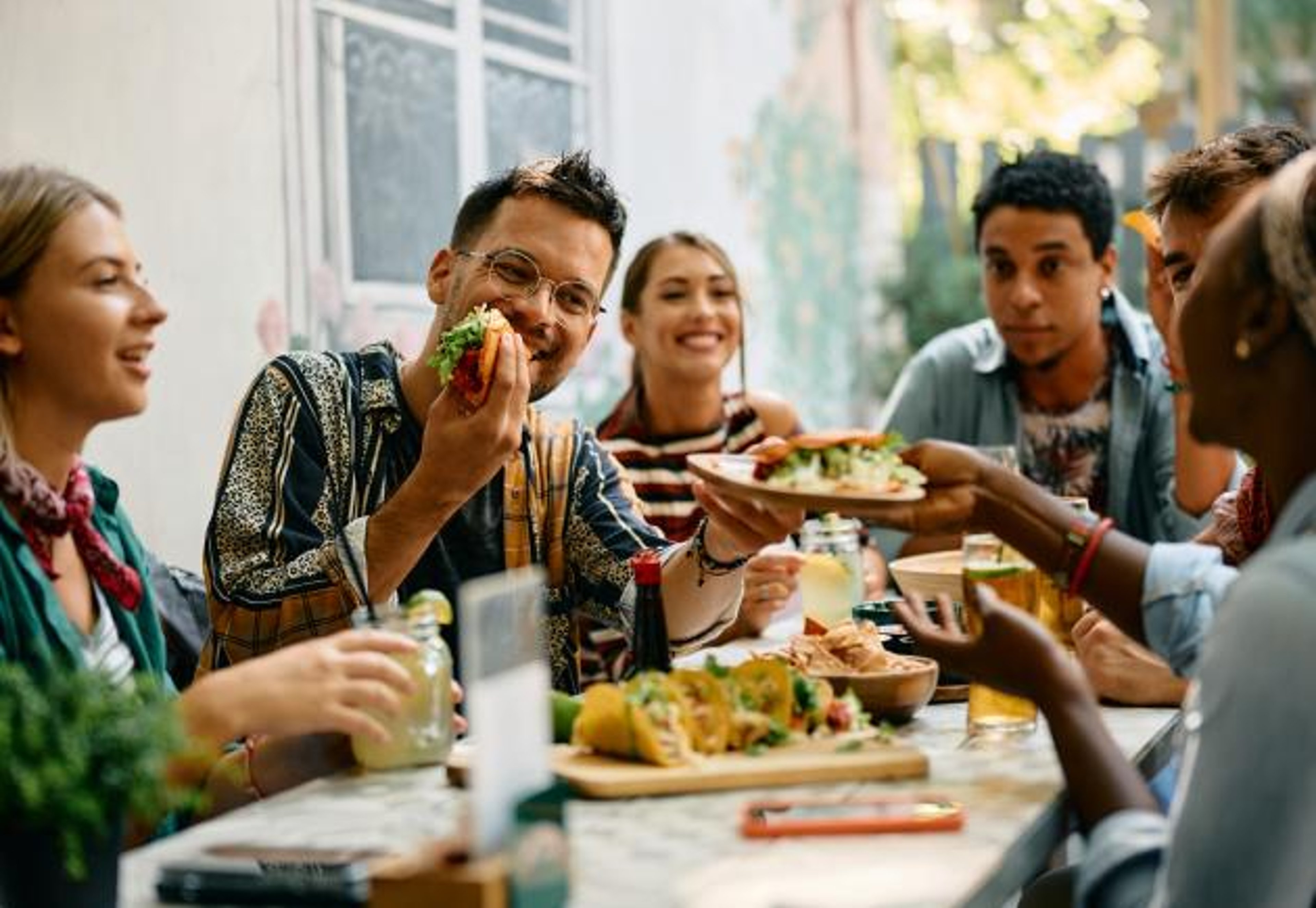 Image of happy people eating lunch together