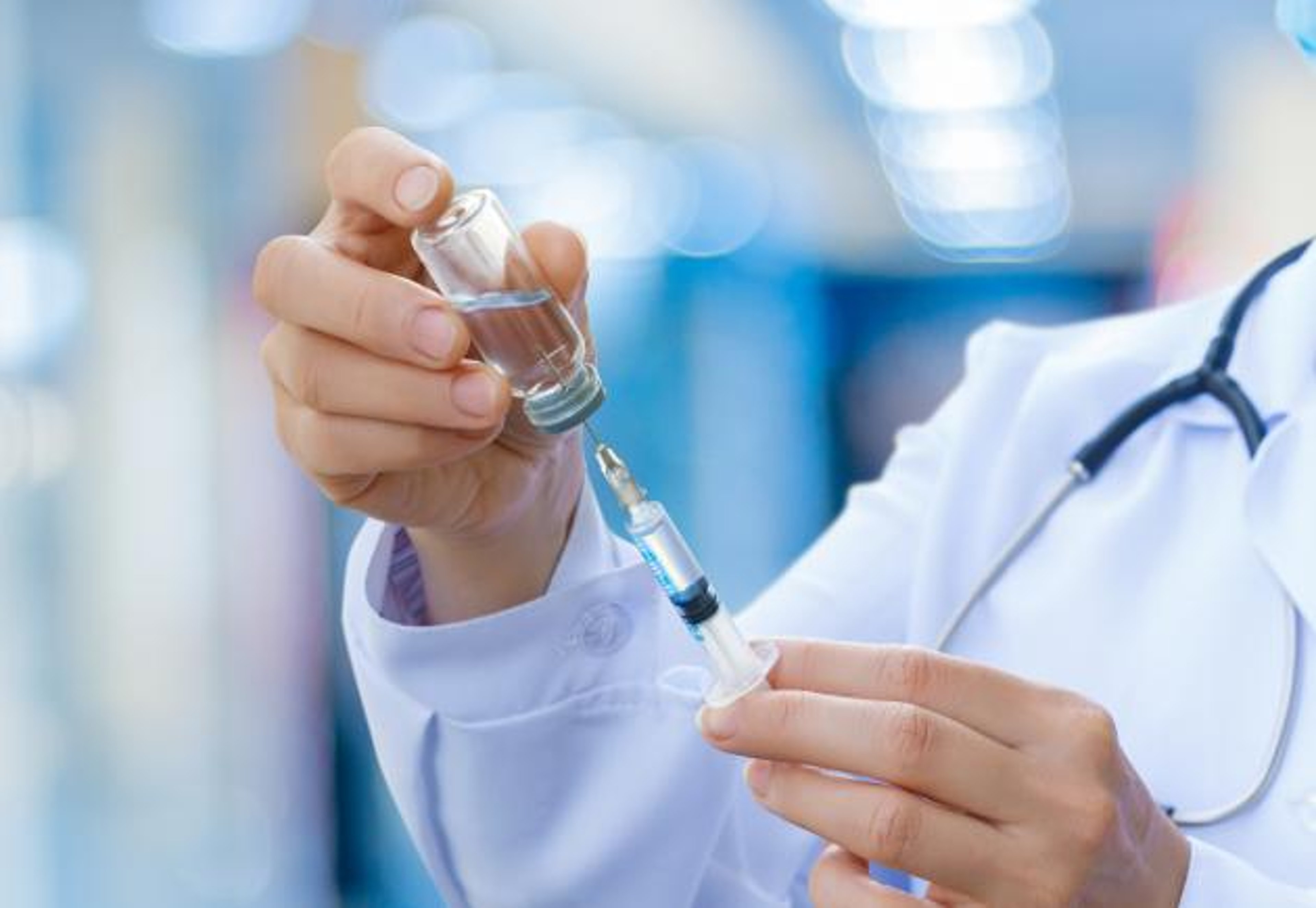 image of doctor preparing syringe