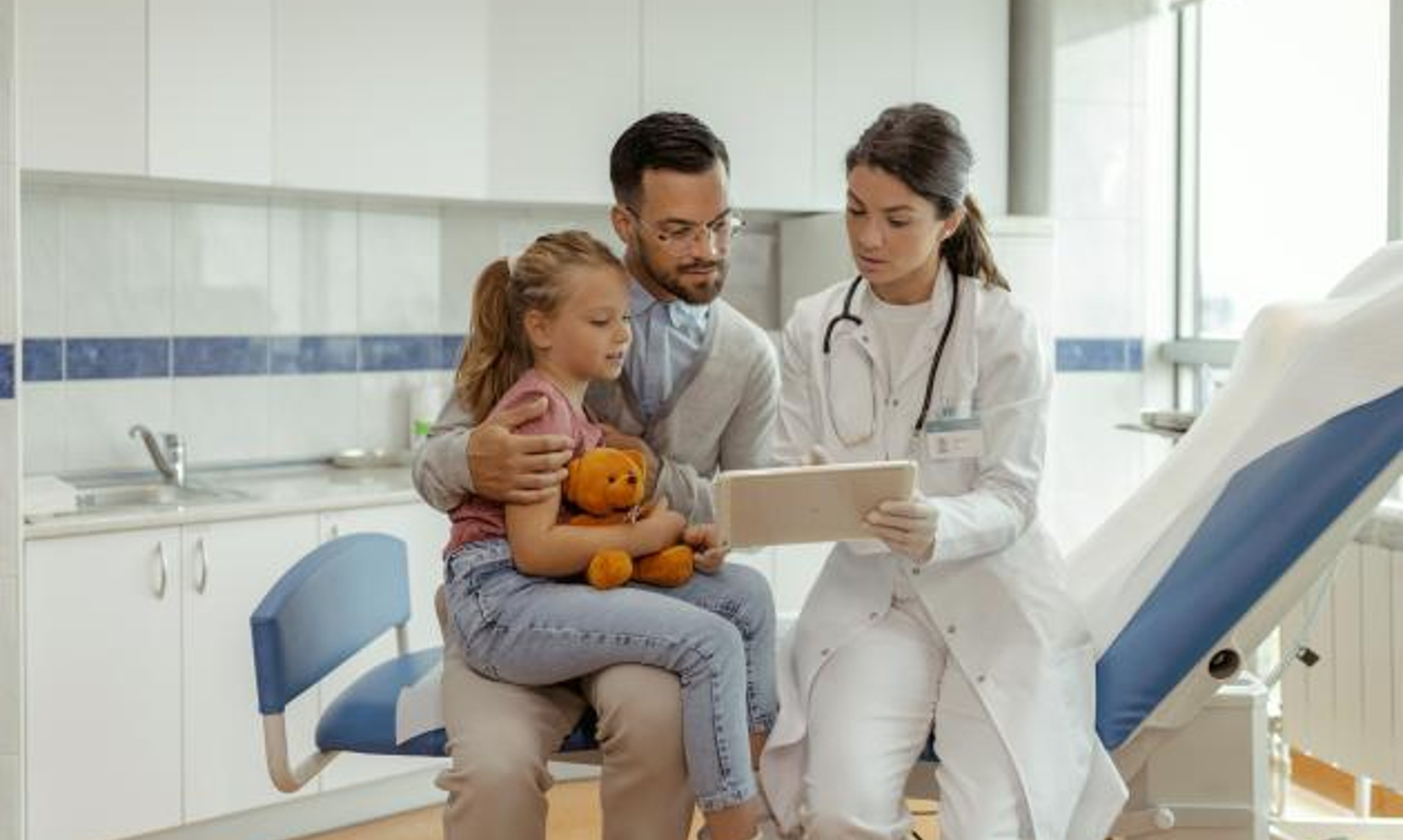 Doctor talking to parent and child
