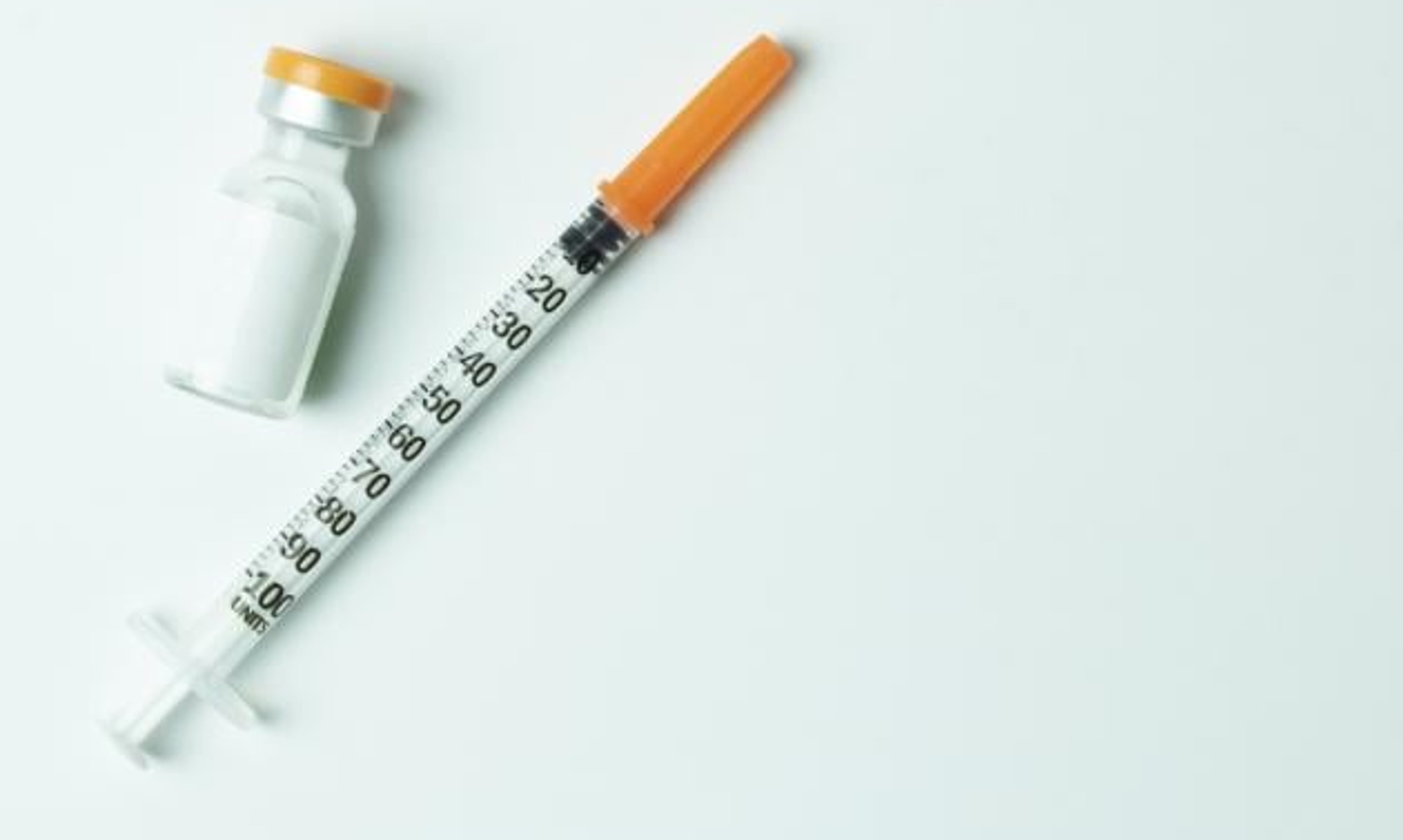Injection and vial green background
