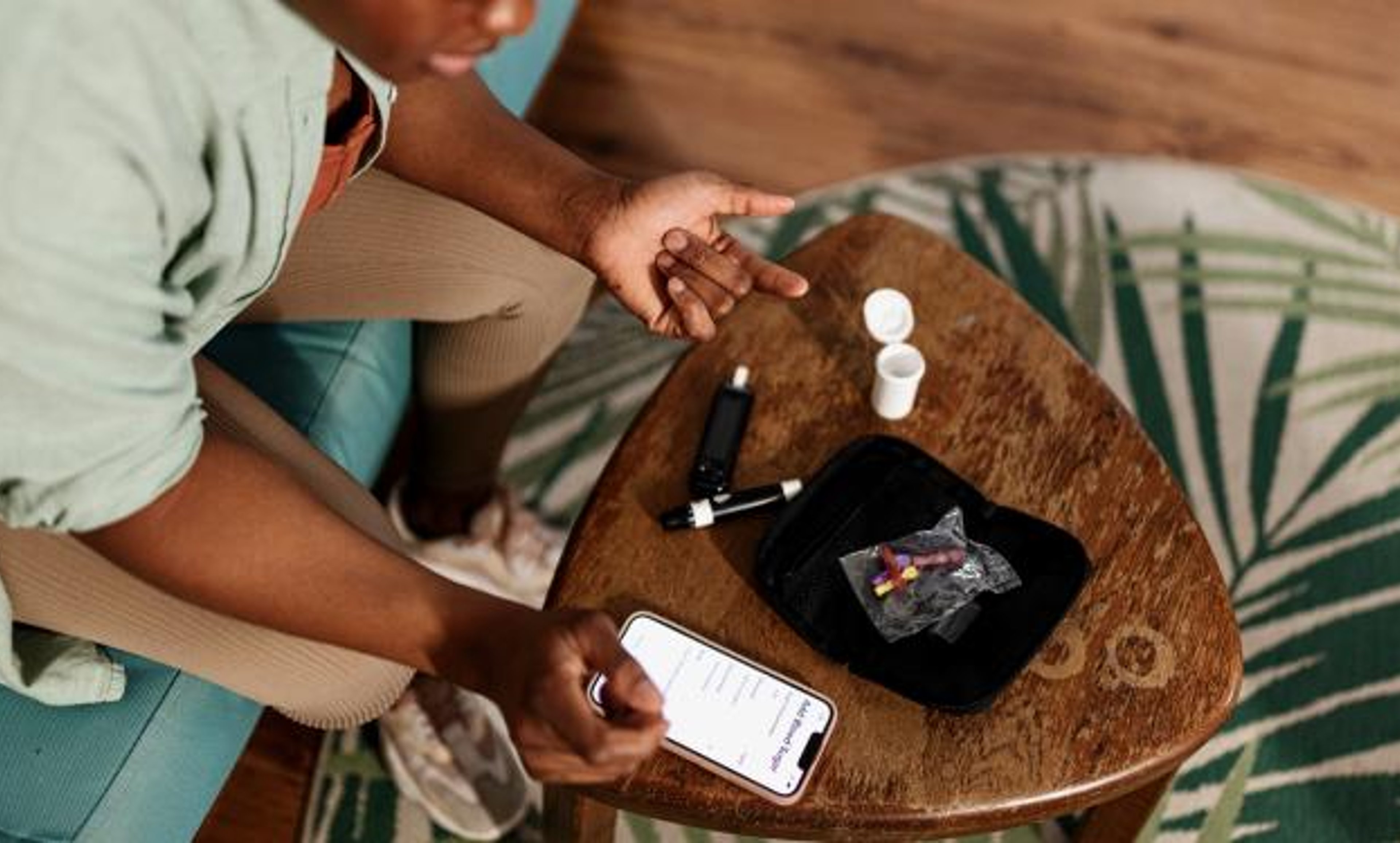 Man checking glucometer