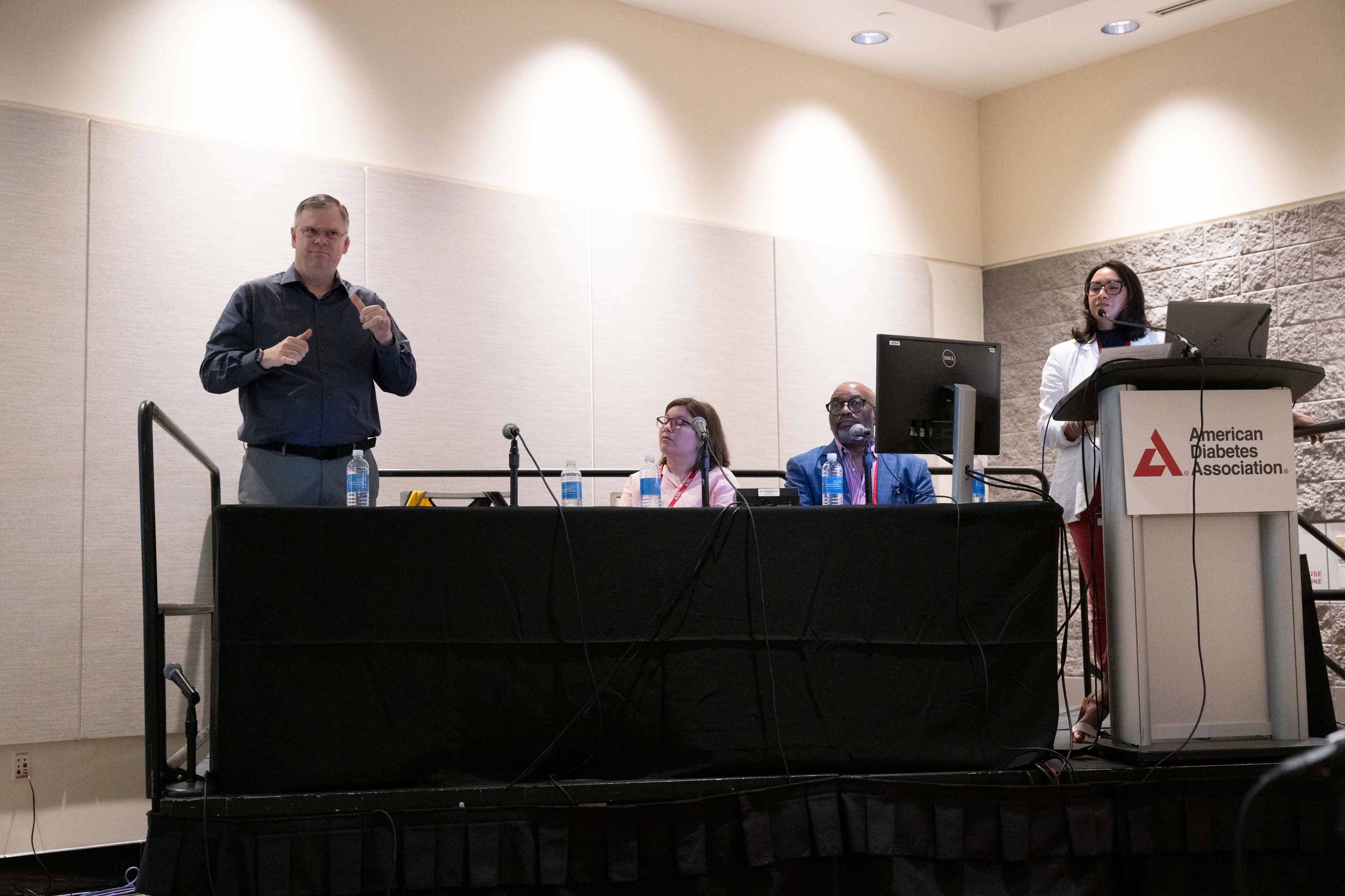 Ryan Layton presents using ASL at a 2024 ADA Conference session, with (from left) Allyson Hughes,  professor of primary care at Ohio University; Chelcie Rice, who spoke about having type 1 diabetes and vision loss; and Michelle Litchman, medical director of the Intensive Diabetes Education and Support Program at the University of Utah.