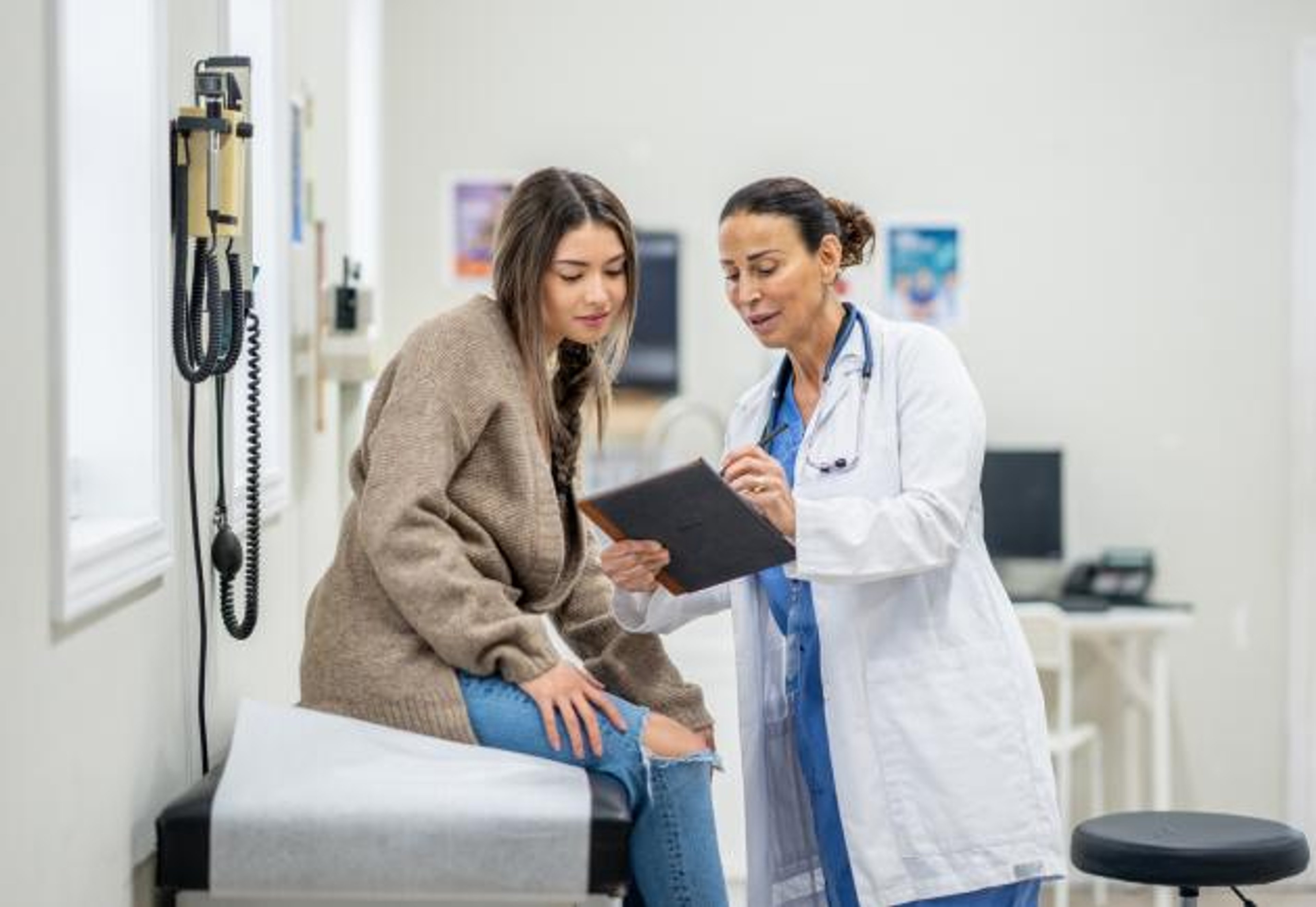 Doctor talking with young patient