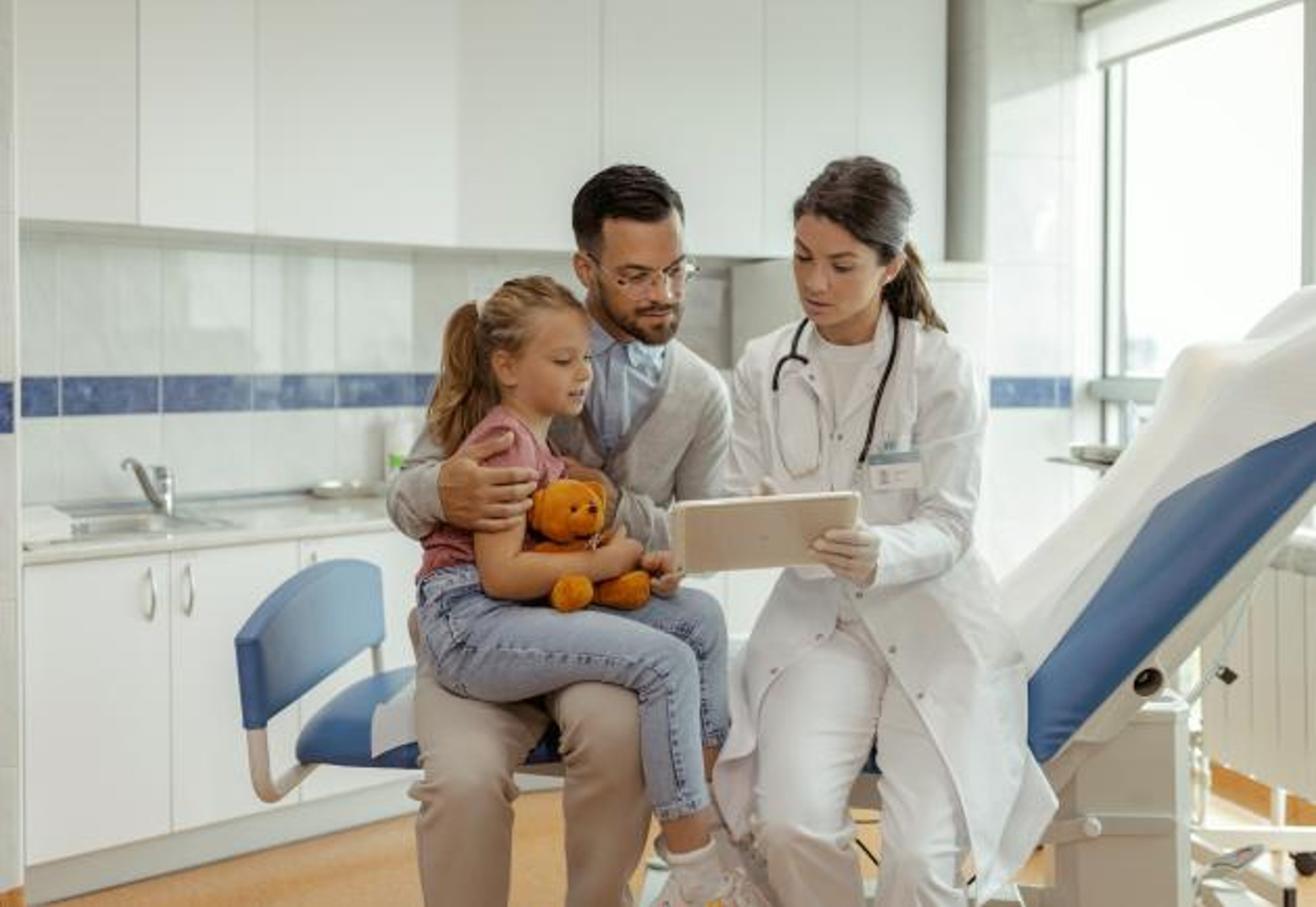 Doctor talking to parent and child