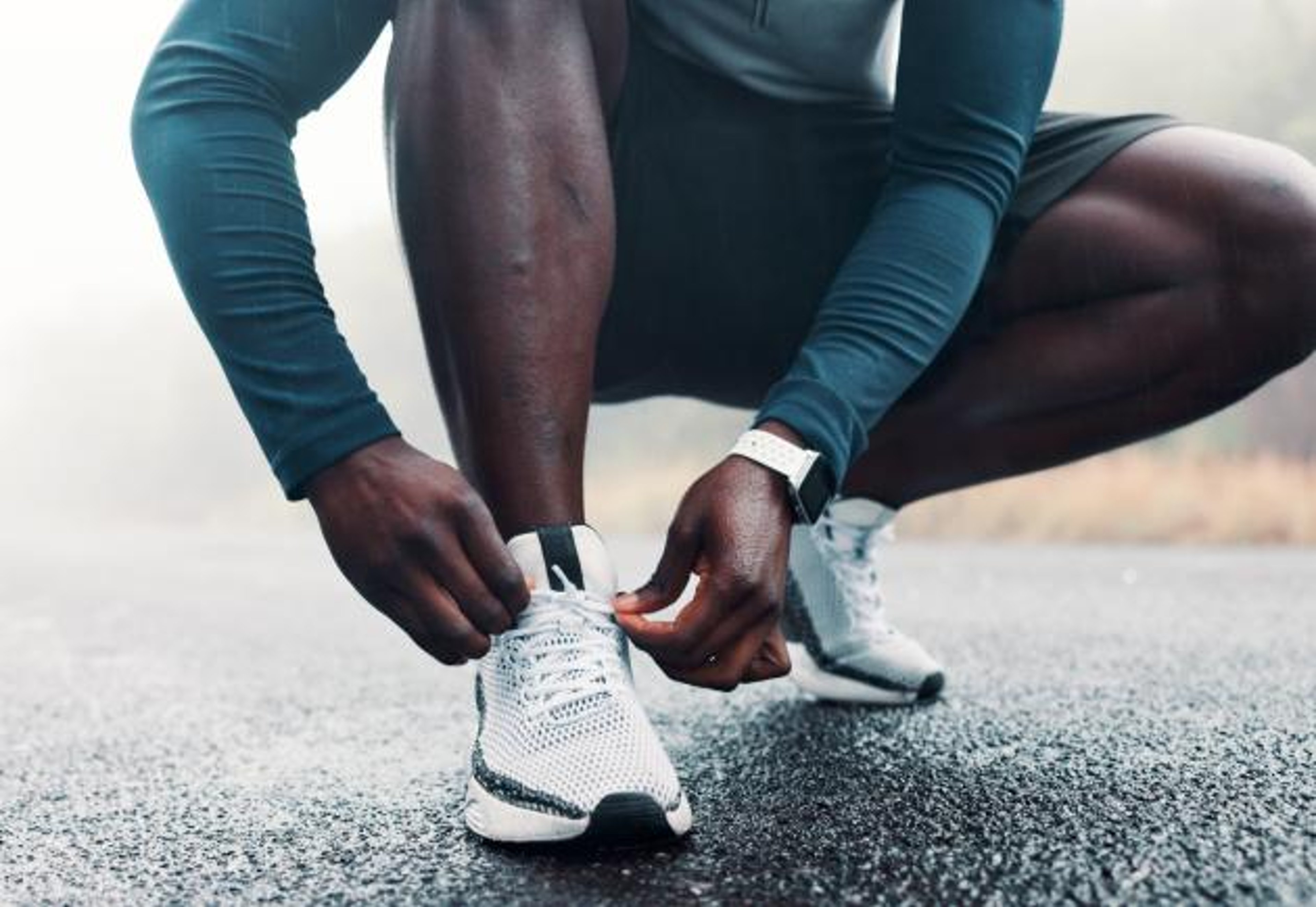 A man ties his shoes