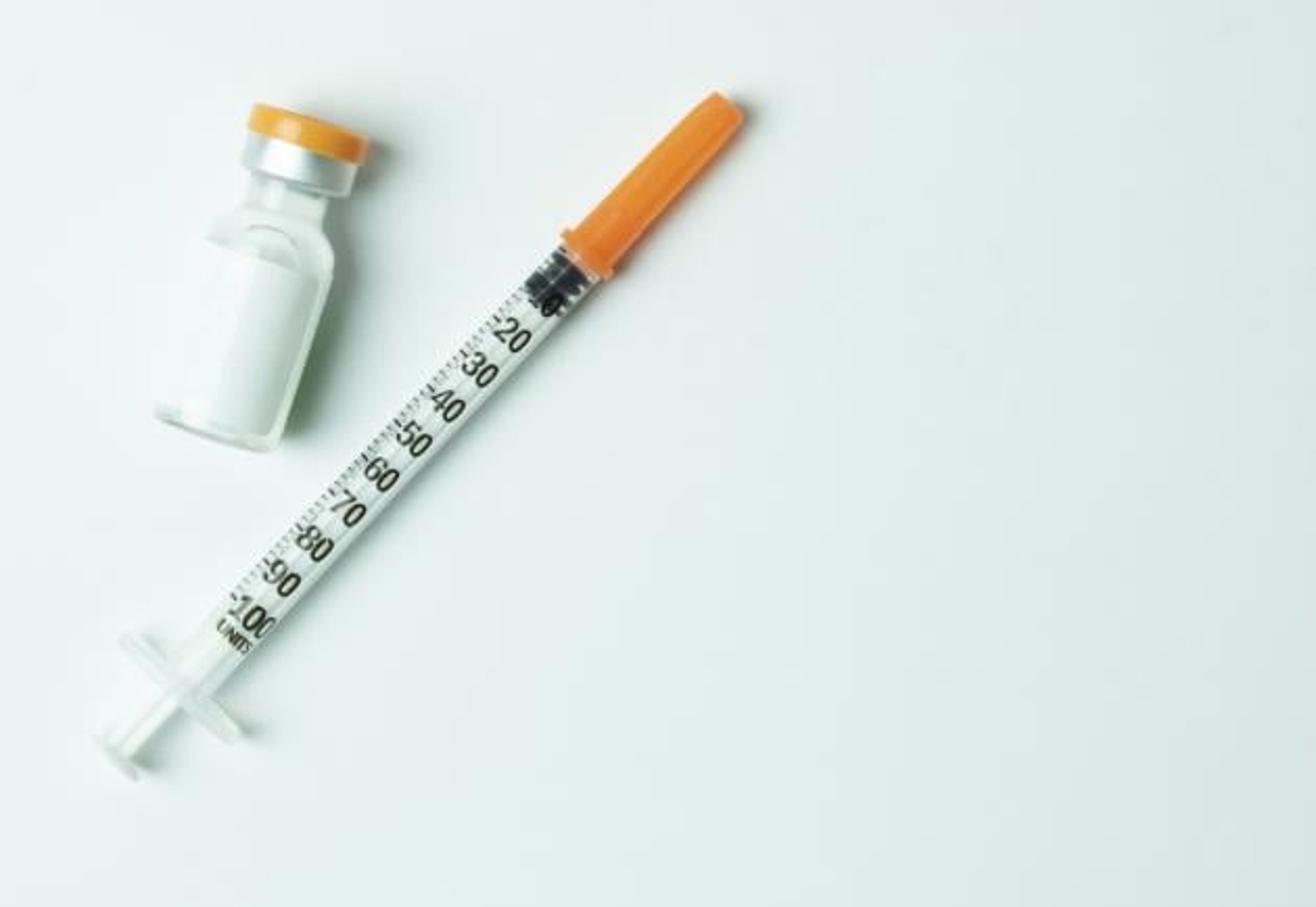 Injection and vial green background
