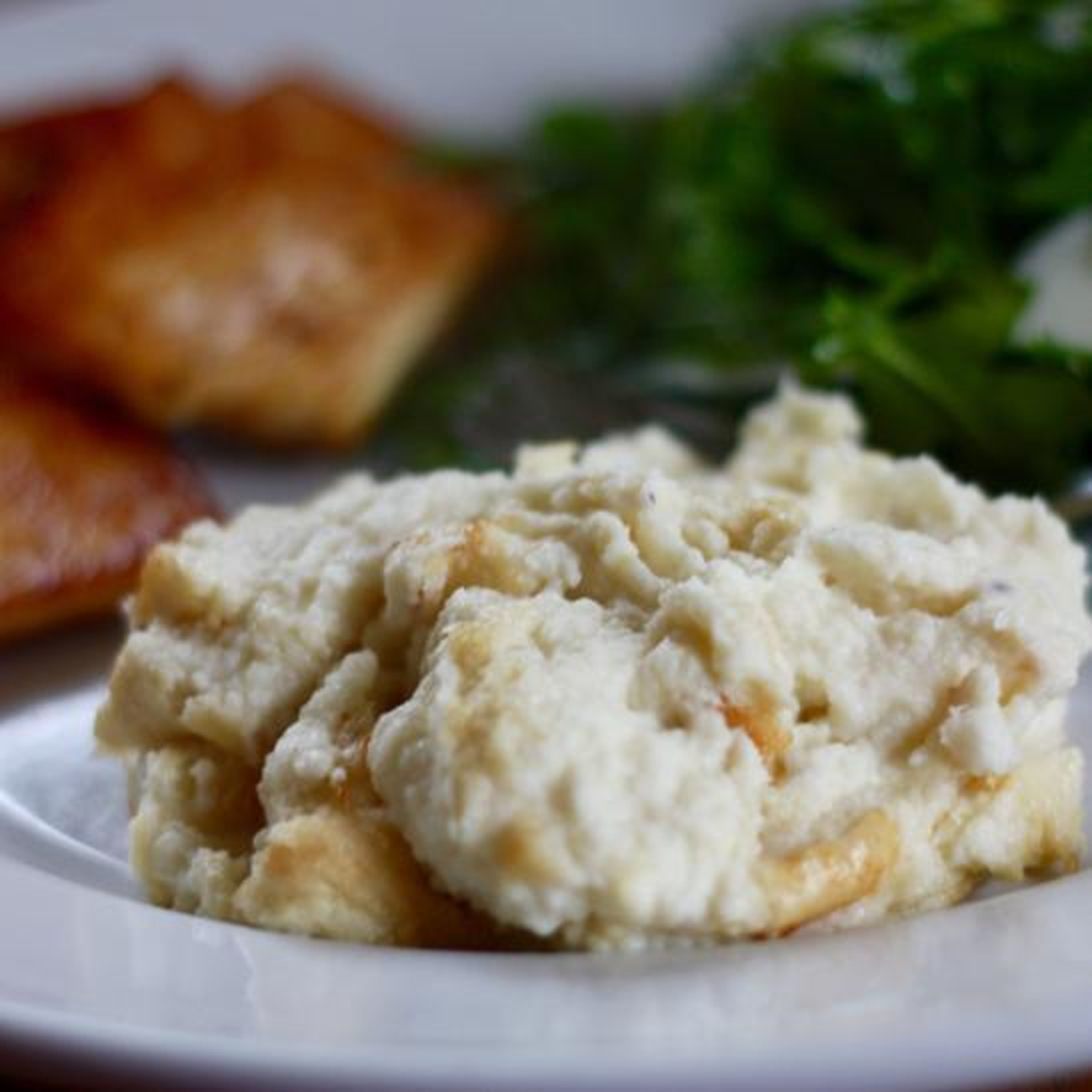 Creamy mashed cauliflower serving on plate