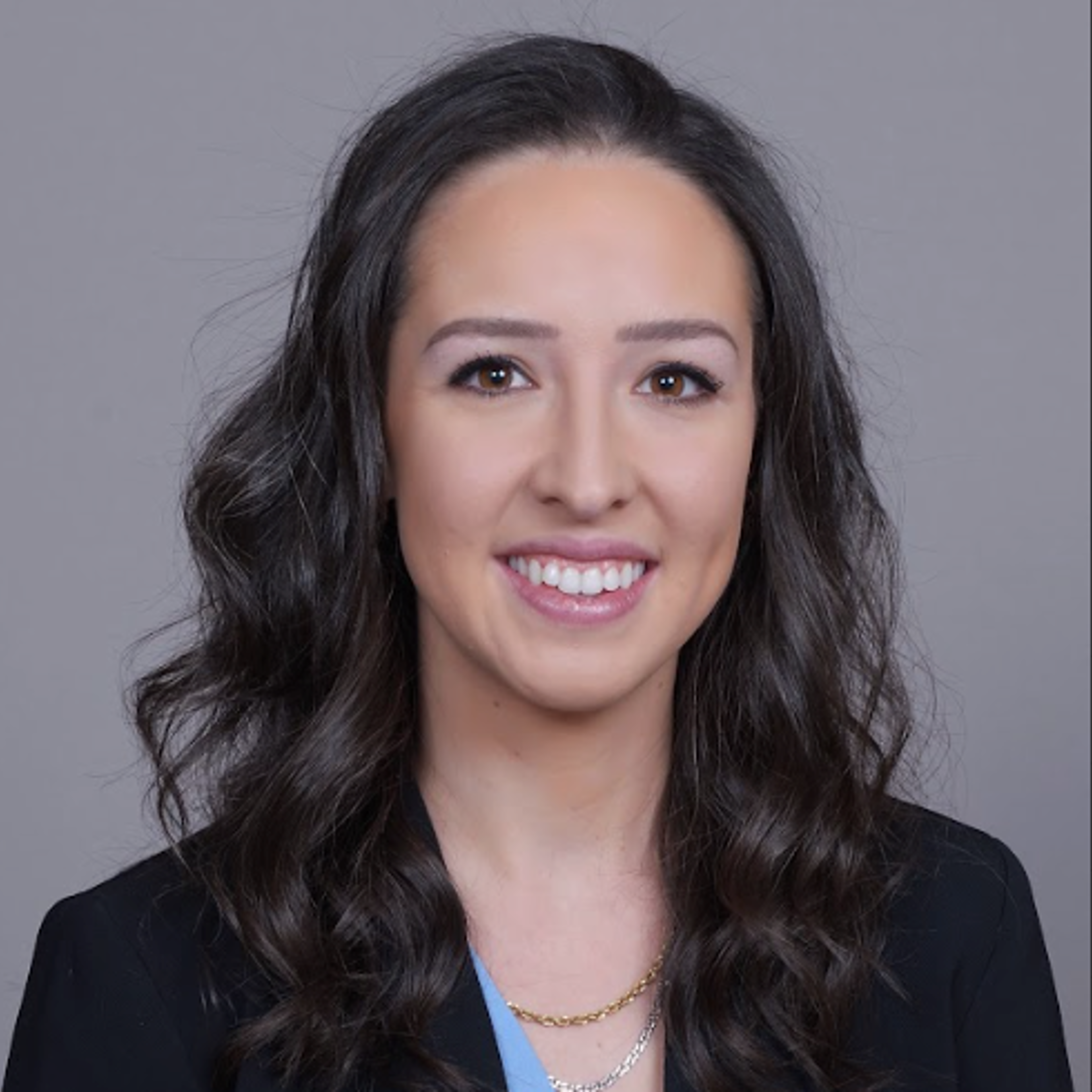 Photo of Philly De Piante, a younger woman with long wavy dark hair