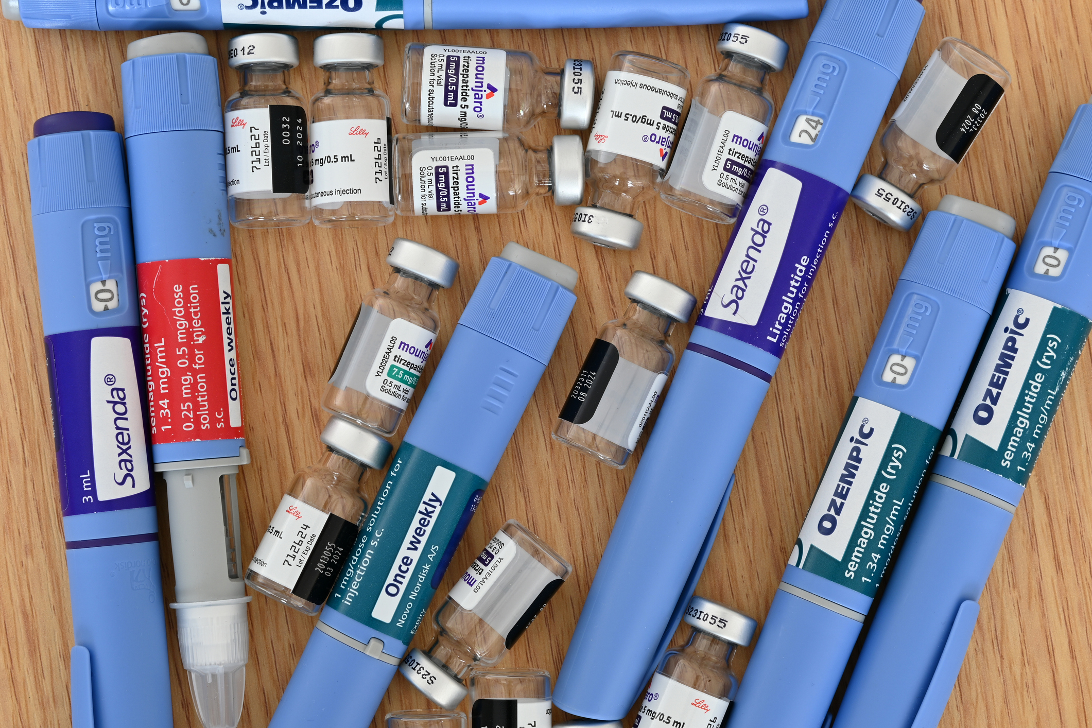 An assortment of injectable diabetes medications on a table