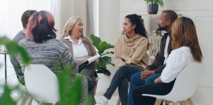 People attend a support group